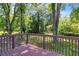 Enjoy serene views from this private deck nestled among mature trees and lush foliage at 4373 Sun Valley Blvd, Atlanta, GA 30344