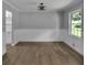 An inviting dining area with light-colored hardwood floors and natural light creates a welcoming ambiance at 4373 Sun Valley Blvd, Atlanta, GA 30344