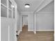 Welcoming entryway featuring hardwood floors, neutral paint, and a modern light fixture above the door at 4373 Sun Valley Blvd, Atlanta, GA 30344