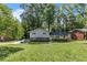 Charming two-story home with gray siding, brick accents, and a lush front lawn at 4373 Sun Valley Blvd, Atlanta, GA 30344