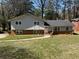Charming two-story home with a combination of brick and siding and a well-maintained front yard at 4373 Sun Valley Blvd, Atlanta, GA 30344