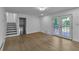 The light-filled living room features hardwood floors, access to a deck, and a staircase at 4373 Sun Valley Blvd, Atlanta, GA 30344