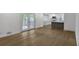 Open concept living room with hardwood floors flowing into a modern kitchen at 4373 Sun Valley Blvd, Atlanta, GA 30344