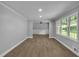 Bright, open living room with hardwood floors, recessed lighting, and large windows providing natural light at 4373 Sun Valley Blvd, Atlanta, GA 30344