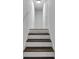 An inviting staircase with white risers and rich wood treads leads to the upper level at 4373 Sun Valley Blvd, Atlanta, GA 30344