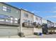 Row of modern townhomes featuring private decks, garages, and diverse color palettes at 1181 Rambler Cross, Atlanta, GA 30312