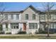 Charming townhome featuring a painted brick facade, colorful doors, well-maintained landscaping, and a welcoming entrance at 1181 Rambler Cross, Atlanta, GA 30312