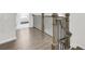 Bright hallway with hardwood floors and an elegant staircase, leading to bedroom at 1181 Rambler Cross, Atlanta, GA 30312
