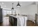 Modern kitchen with a large kitchen island and an open view into the living room at 1181 Rambler Cross, Atlanta, GA 30312