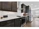 Kitchen with stainless steel appliances, sleek cabinetry, and quartz countertops at 1181 Rambler Cross, Atlanta, GA 30312