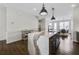 Modern kitchen with a large island, dark wood cabinets, and stylish lighting at 1181 Rambler Cross, Atlanta, GA 30312