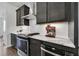 Kitchen with stainless steel appliances, modern cabinetry, and quartz countertops at 1181 Rambler Cross, Atlanta, GA 30312