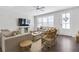 Comfortable living room featuring hardwood floors, modern lighting, comfortable seating, and access to the outside at 1181 Rambler Cross, Atlanta, GA 30312