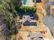 An aerial view of the house showcasing its position on a well manicured lot at 153 Newcastle Walk, Woodstock, GA 30188