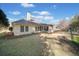 A view of the home's backyard, and a partially covered screened in porch at 153 Newcastle Walk, Woodstock, GA 30188