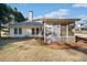 A view of the home's backyard, and a partially covered screened in porch at 153 Newcastle Walk, Woodstock, GA 30188