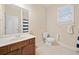 Bathroom featuring a single sink vanity and toilet at 153 Newcastle Walk, Woodstock, GA 30188