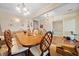 Formal dining area enhanced by neutral walls, chandelier, and a cozy carpet, perfect for special occasions at 153 Newcastle Walk, Woodstock, GA 30188