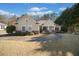 Charming home features a landscaped front yard, brick accents, and a welcoming entrance, radiating curb appeal at 153 Newcastle Walk, Woodstock, GA 30188