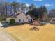 Beautiful home featuring a lush lawn, private driveway, and serene backyard, creating a tranquil oasis at 153 Newcastle Walk, Woodstock, GA 30188