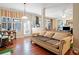 Inviting living room with large windows, hardwood floors, and a view of the outdoor scenery at 153 Newcastle Walk, Woodstock, GA 30188