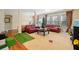 Spacious living room with sofas, large windows, and a Christmas tree in the background at 153 Newcastle Walk, Woodstock, GA 30188