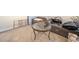 Open living room featuring a sofa, carpet, and glass table at 153 Newcastle Walk, Woodstock, GA 30188