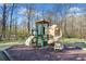 Well-maintained community playground with slide and climbing structure provides outdoor fun at 153 Newcastle Walk, Woodstock, GA 30188