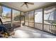 Relax in this screened-in porch, featuring tile flooring and plenty of natural light and breeze at 153 Newcastle Walk, Woodstock, GA 30188