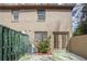 This backyard features an AC unit, a brick wall, a fenced yard and French doors to the home at 3077 Colonial Way # F, Atlanta, GA 30341