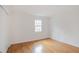 Bright bedroom with hardwood floors, closet, and natural light from the window at 3077 Colonial Way # F, Atlanta, GA 30341