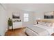 Stylishly furnished bedroom with hardwood floors, neutral colors, and natural light at 3077 Colonial Way # F, Atlanta, GA 30341