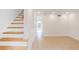 Inviting hallway with tile floors and staircase leading to upper level at 3077 Colonial Way # F, Atlanta, GA 30341