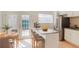 Modern kitchen with a granite-topped island, stainless steel appliances, and French doors at 3077 Colonial Way # F, Atlanta, GA 30341