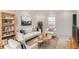 Bright living room featuring neutral decor, stylish furniture, and ample natural light at 3077 Colonial Way # F, Atlanta, GA 30341