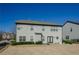 A two-story home with a gray exterior overlooking the backyard at 3815 Pleasant Woods Dr, Cumming, GA 30028