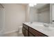 Bathroom features a double sink vanity with dark cabinets, and a large mirror at 3815 Pleasant Woods Dr, Cumming, GA 30028