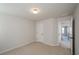 Bedroom features neutral walls, trim, and carpet at 3815 Pleasant Woods Dr, Cumming, GA 30028
