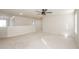 Bonus room has carpet, light colored walls, and a ceiling fan at 3815 Pleasant Woods Dr, Cumming, GA 30028