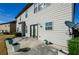 The home's exterior features gray siding and a concrete patio at 3815 Pleasant Woods Dr, Cumming, GA 30028