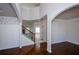 Spacious foyer with hardwood floors, staircase, and archway at 3815 Pleasant Woods Dr, Cumming, GA 30028