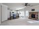 Spacious living room open to the kitchen with stone fireplace at 3815 Pleasant Woods Dr, Cumming, GA 30028