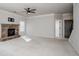 Carpeted living room with stone fireplace and large windows for natural light at 3815 Pleasant Woods Dr, Cumming, GA 30028