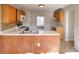 Spacious kitchen includes wooden cabinets, white countertops, and modern appliances at 4751 Lorient Ct, Snellville, GA 30039