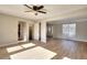 Inviting living room showcasing an open layout, ceiling fan, and wood-look flooring at 4751 Lorient Ct, Snellville, GA 30039