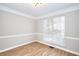 Living room showcasing neutral walls, white trim, and bright recessed lighting at 4751 Lorient Ct, Snellville, GA 30039