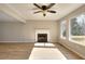 Light filled living room offering an open layout, fireplace, and expansive windows with natural light at 4751 Lorient Ct, Snellville, GA 30039