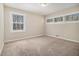 Bright bedroom featuring multiple windows and neutral carpeting for a cozy feel at 2254 Whites Mill Rd, Decatur, GA 30032
