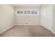 Bedroom with a row of windows offering natural light and a closet for storage at 2254 Whites Mill Rd, Decatur, GA 30032