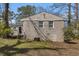 Back exterior of the home showing brick siding and two windows at 2254 Whites Mill Rd, Decatur, GA 30032
